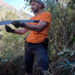 Yaroslav is sharpening machete